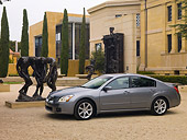 AUT 42 RK0095 01
2007 Nissan Maxima 3.5 SE Gray 3/4 Side View On Pavement By Statue