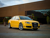 AUT 42 RK0114 01
2007 Audi RS4 Yellow 3/4 Low Front View On Pavement By Building