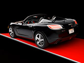 AUT 42 RK0136 02
2007 Saturn Sky Turbo Convertible Black 3/4 Rear View On Red Floor Studio
