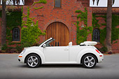 AUT 42 RK0217 01
2007 Volkswagen New Beetle Convertible White Profile View On Pavement By Brick Building
