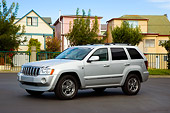 AUT 42 RK0266 01
2007 Jeep Grand Cherokee Overland Silver 3/4 Front View On Pavement By Houses Trees Blue Sky