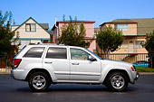 AUT 42 RK0269 01
2007 Jeep Grand Cherokee Overland Silver Profile View On Pavement By Houses Trees Blue Sky