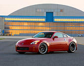 AUT 42 RK0275 01
2007 Nissan 350Z Red 3/4 Front View On Pavement By Hangar
