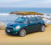AUT 43 BK0013 01
2007 Mini Cooper S Green And Checkered 3/4 Front View On Beach