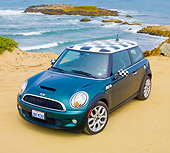 AUT 43 BK0014 01
2007 Mini Cooper S Green And Checkered 3/4 Front View On Beach