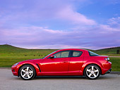 AUT 43 BK0001 01
2008 Mazda RX-8 Red Profile View On Pavement By Hills