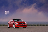 AUT 43 RK0060 01
2008 Nissan Altima 2-Door Coupe Red Front 3/4 View On Pavement Moon Clouds