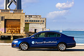 AUT 43 RK0095 01
2008 Volkswagen Passat BlueMotion Diesel Blue Profile View On Pavement By Bridge Water Sky