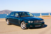 AUT 43 RK0170 01
2008 Jaguar XJ Super V8 Green 3/4 Front View By Water