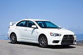 AUT 43 RK0306 01
2008 Mitsubishi Lancer Evolution GSR White 3/4 Front View Blue Sky