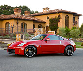 AUT 43 RK0316 01
2008 Nissan 350Z Red 3/4 Front View On Pavement By House