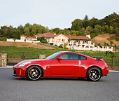 AUT 43 RK0317 01
2008 Nissan 350Z Red Profile View On Pavement By House