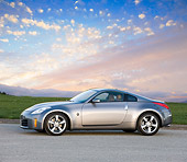 AUT 43 RK0318 01
2008 Nissan 350Z Silver 3/4 Front View On Pavement By Trees