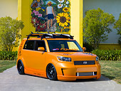 AUT 43 RK0334 01
2008 Scion xB Orange 3/4 Front View By Building