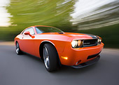 AUT 43 RK0373 01
2008 Dodge Challenger SRT8 Orange 3/4 Front View On Road By Trees