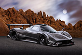 AUT 44 BK0007 01
2009 Pagani Zonda R Gray 3/4 Front View On Pavement By Red Rock And Moon