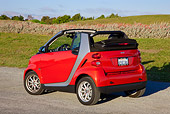 AUT 44 RK0095 01
2009 Smart Fortwo Passion Cabriolet Red And Silver 3/4 Rear View On Pavement By Field
