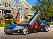 AUT 44 RK0130 01
2009 Spyker C8 Aileron Gray 3/4 Front View On Pavement By House