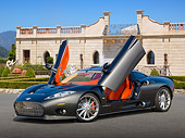 AUT 44 RK0132 01
2009 Spyker C8 Aileron Gray 3/4 Front View On Pavement By House