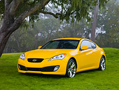 AUT 44 RK0016 01
2009 Hyundai Genesis Coupe Yellow 3/4 Front View On Grass