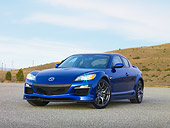 AUT 44 RK0023 01
2009 Mazda RX-8 R3 Coupe Blue 3/4 Front View On Pavement By Hills