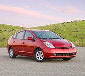 AUT 44 RK0026 01
2009 Toyota Prius Red 3/4 Front View On Pavement By Hills