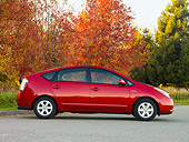 AUT 44 RK0030 01
2009 Toyota Prius Red Profile View On Pavement By Autumn Trees