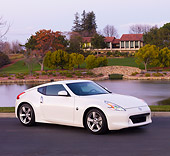 AUT 44 RK0047 01
2009 Nissan 370Z Coupe White 3/4 Front View On Street