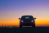 AUT 45 BK0001 01
2010 Honda Insight Blue Front View On Pavement With Sunset
