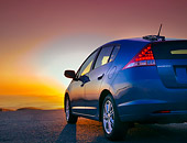AUT 45 BK0003 01
2010 Honda Insight Blue 3/4 Rear View On Pavement With Sunset