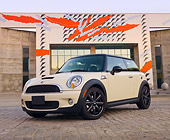 AUT 45 BK0007 01
2010 Mini Cooper S White 3/4 Front View On Brick By Building