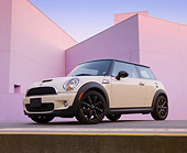 AUT 45 BK0010 01
2010 Mini Cooper S White 3/4 Front View On Concrete By Structure