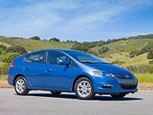 AUT 45 RK0021 01
2010 Honda Insight Hybrid Blue 3/4 Front View On Pavement By Hills