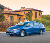 AUT 45 RK0046 01
2010 Honda Insight Blue 3/4 Front View On Pavement By House