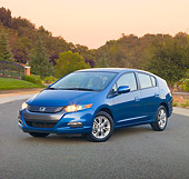AUT 45 RK0047 01
2010 Honda Insight Blue 3/4 Front View On Pavement By Trees