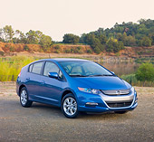 AUT 45 RK0049 01
2010 Honda Insight Blue 3/4 Front View On Pavement By Lake