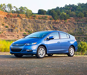 AUT 45 RK0050 01
2010 Honda Insight Blue 3/4 Front View On Pavement By Lake