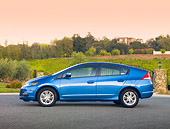 AUT 45 RK0051 01
2010 Honda Insight Blue Profile View On Pavement By Fence
