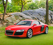 AUT 45 RK0064 01
2010 Audi R8 5.2 FSI Quattro Red 3/4 Front View On Grass