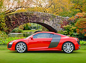 AUT 45 RK0066 01
2010 Audi R8 5.2 FSI Quattro Red Profile View On Grass By Bridge