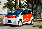 AUT 45 RK0004 01
2010 Mitsubishi i MiEV White And Red 3/4 Front View On Pavement By Palm Trees