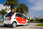 AUT 45 RK0008 01
2010 Mitsubishi i MiEV White And Red 3/4 Rear View On Pavement By Palm Trees