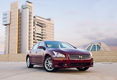 AUT 46 BK0004 01
2011 Nissan Maxima 3.5 SV Premium Red 3/4 Front View In Parking Lot By Building
