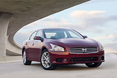 AUT 46 BK0005 01
2011 Nissan Maxima 3.5 SV Premium Red 3/4 Front View On Pavement Under Overpass