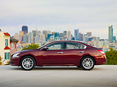 AUT 46 BK0006 01
2011 Nissan Maxima 3.5 SV Premium Red Profile View On Pavement By City Skyline
