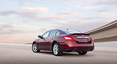 AUT 46 BK0007 01
2011 Nissan Maxima 3.5 SV Premium Red 3/4 Rear View On Pavement Under Overpass