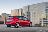AUT 46 BK0018 01
2011 Ford Fiesta Red 3/4 Rear View On Pavement By Buildings