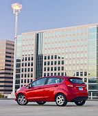AUT 46 BK0020 01
2011 Ford Fiesta Red 3/4 Rear View On Pavement By Buildings