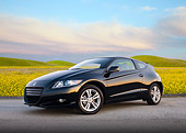 AUT 46 BK0041 01
2011 Honda CR-Z Black 3/4 Front View On Pavement By Field Of Wildflowers