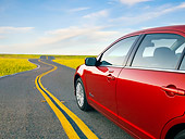 AUT 46 BK0049 01
2011 Ford Fusion Hybrid Red Detail On Road By Field Of Wildflowers